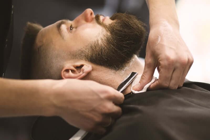 Straight-razor shave along the beard line